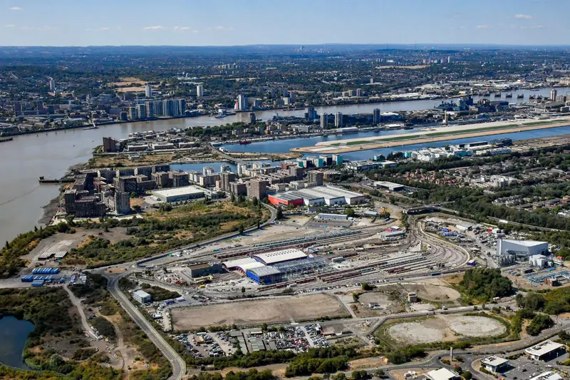 Aerial photo of Beckton Gas Works with the River Thames, London City Airport and Canary Wharf beyond
